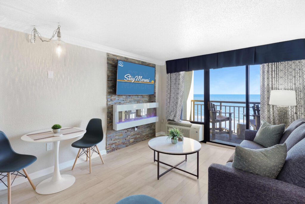 Oceanside Escape suite with modern fireplace and ocean view at StayMareni Myrtle Beach